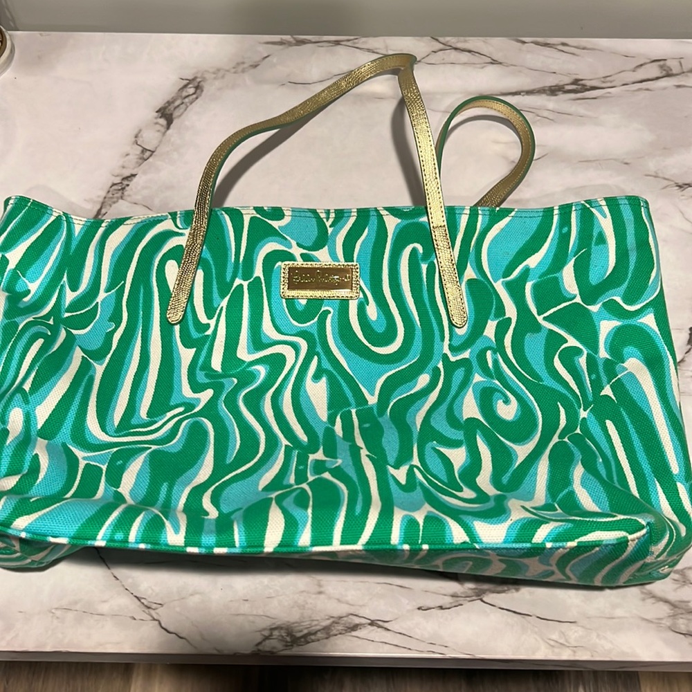 Practically new green and gold Lilly Pulitzer tote. Great for traveling!